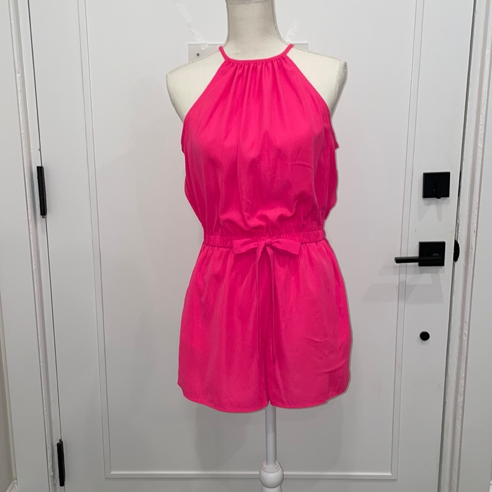 Hot pink one piece romper size large. More of a juniors large. Never worn